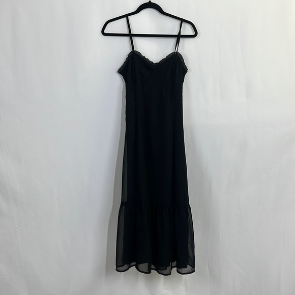 Fitted black spaghetti strap dress and corset and ruffle detail and tiered skirt - Picture 1 of 8